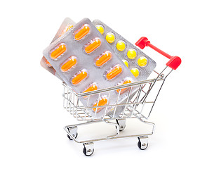 Image showing Multicolored pills packs in shopping cart