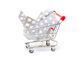 Image showing White pills packs in shopping cart