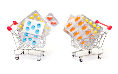 Image showing Multicolored pills packs in shopping cart