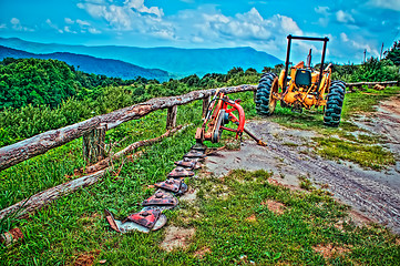 Image showing old tractor in the mountains