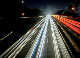 Image showing standing in car on side of the road at night in the city