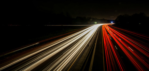 Image showing standing in car on side of the road at night in the city