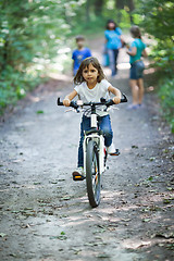 Image showing Little girl on a bicycle