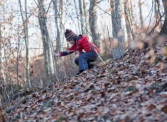 Image showing Little girl descending a hill