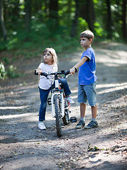 Image showing Children with a bicycle