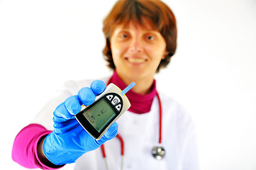 Image showing doctor checking diabetic's blood sugar 