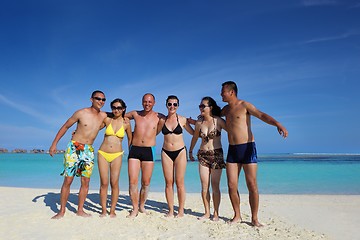 Image showing group of happy young people have fun on bach