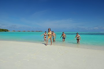 Image showing group of happy young people have fun on bach