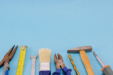 Image showing hand work tools set on blue background 