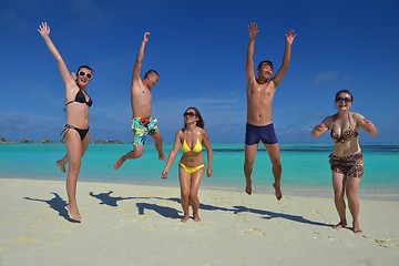 Image showing group of happy young people have fun on bach