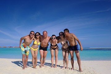 Image showing group of happy young people have fun on bach