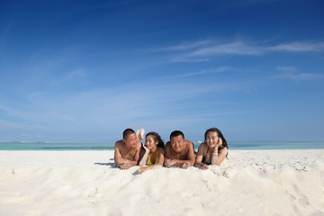 Image showing group of happy young people have fun on bach