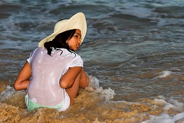 Image showing model in hat in waves