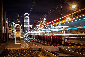 Image showing Charlotte City Skyline night scene with light rail system lynx t