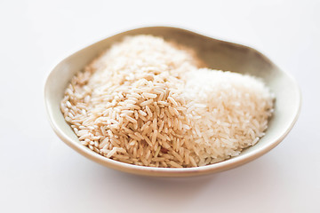 Image showing A mound of natural brown and white rice seeds  