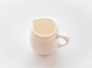 Image showing Empty white ceramic pitcher on clean table