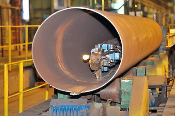 Image showing industrial machine for making steel pipes