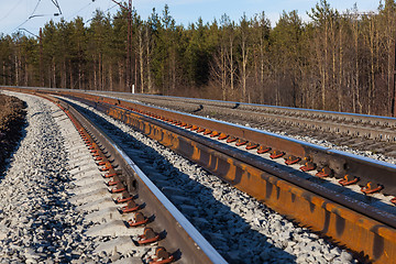 Image showing Railway in the forest makes a smooth turn