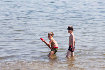 Image showing Water pistol action