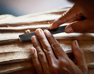 Image showing Hands woodcarver with the tool close-up
