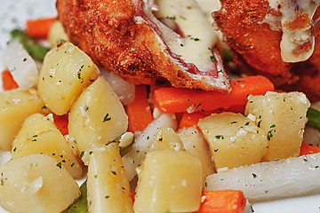 Image showing Chicken Cordon Bleu with boiled potatoes