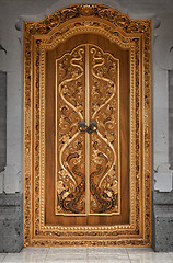 Image showing Wooden door of an old temple with carvings. Indonesia, Bali