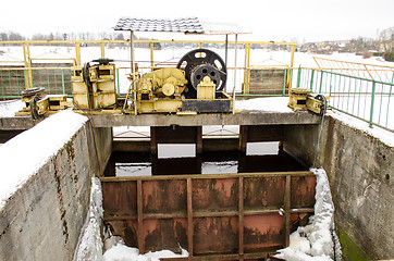 Image showing dam mechanism screw hold steel snow water winter 