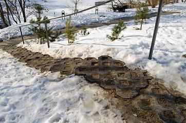 Image showing ornamented staircase iron railings around snow 