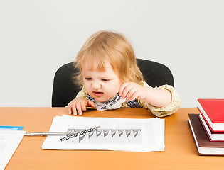 Image showing beautiful business girl analyzing chart