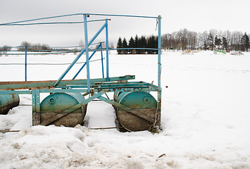 Image showing quay pier steel barrel snow lake shore winter 