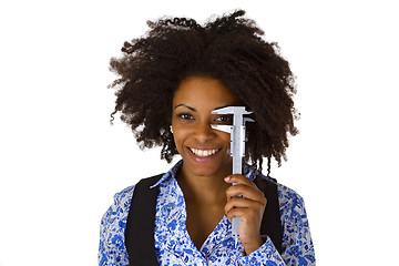 Image showing Attractive african woman holding caliper