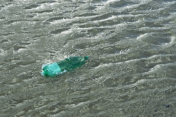 Image showing floating green bottle