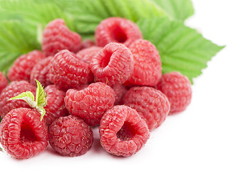 Image showing Ripe raspberry with green leaf