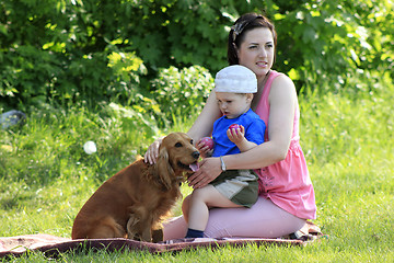 Image showing Mother, child and dog on picnic