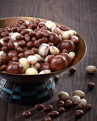Image showing raisins and nuts covered with chocolate