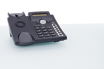 Image showing voip phone on glass desk