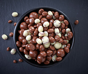 Image showing raisins and nuts covered with chocolate