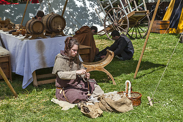 Image showing Medieval Young Woman Spinning Wool