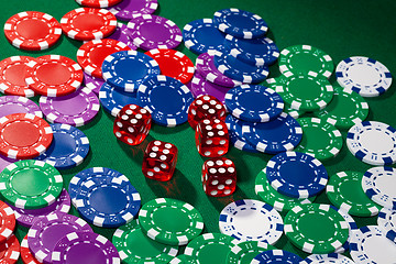 Image showing Colorful poker chips and red dice