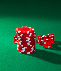 Image showing Red poker chips and red dice