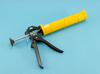 Image showing silicone glue hand work gun tool blue 