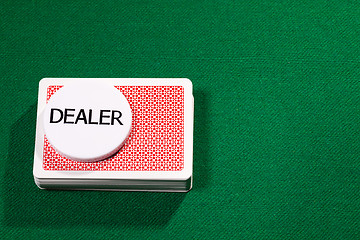 Image showing Poker cards with dealer chip