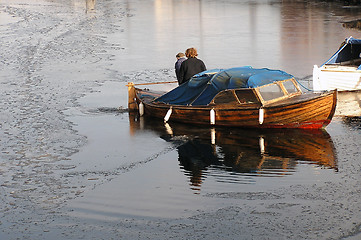 Image showing Old boat in cold water