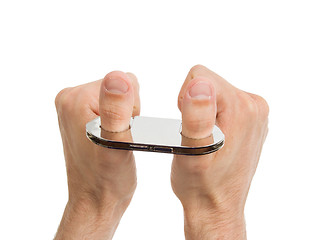 Image showing Adult hands in thumb cuffs isolated