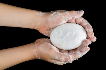 Image showing Lathered hands and soap