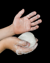 Image showing Lathered hands and soap