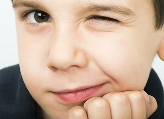 Image showing Little boy wink of an eye