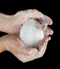 Image showing Lathered hands and soap