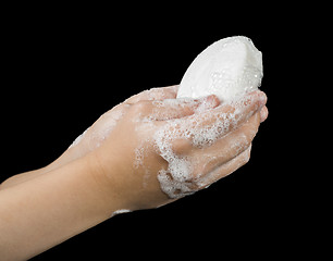 Image showing Lathered hands and soap