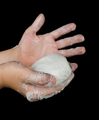 Image showing Lathered hands and soap